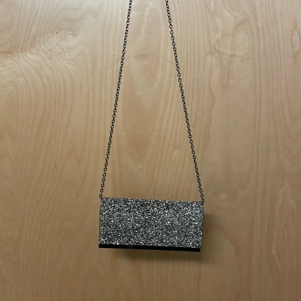 Saks Fifth Avenue sparkly gemstones clutch with chain link strap.
